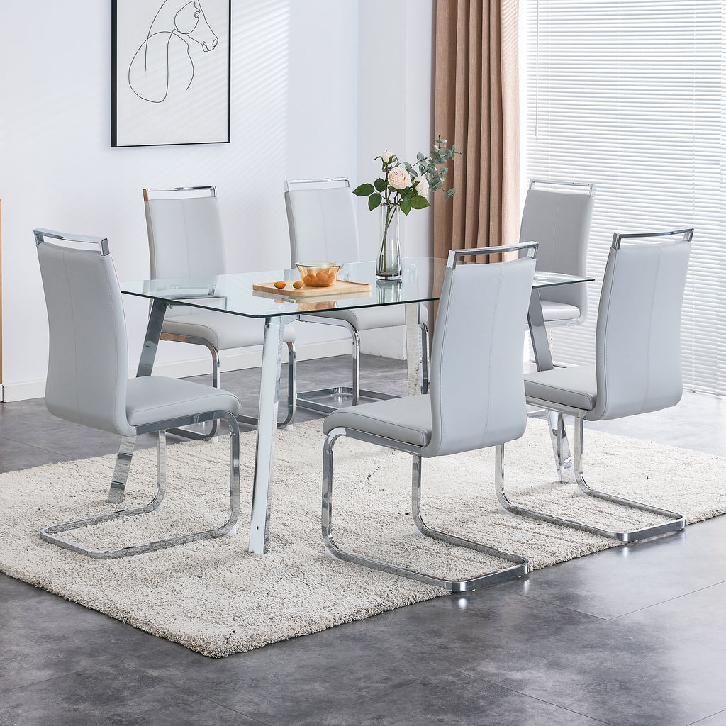 A modern minimalist rectangular glass dining table with tempered glass tabletop and silver metal legs, suitable for kitchens, restaurants, and living rooms,63'*35.4'*30' - Grand Goldman Shop