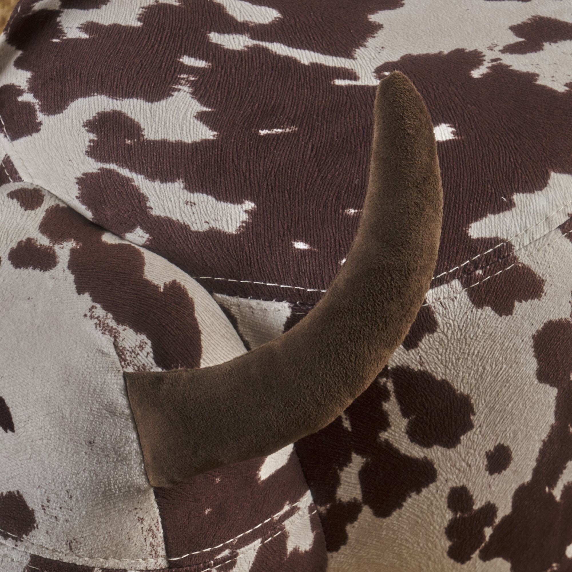 Cow-Shaped Modern Ottoman Footstool in Brown and White Fabric with Velvet Horns, Birch Legs, 25.25 x 14.00 x 16.75 inches - Grand Goldman Shop