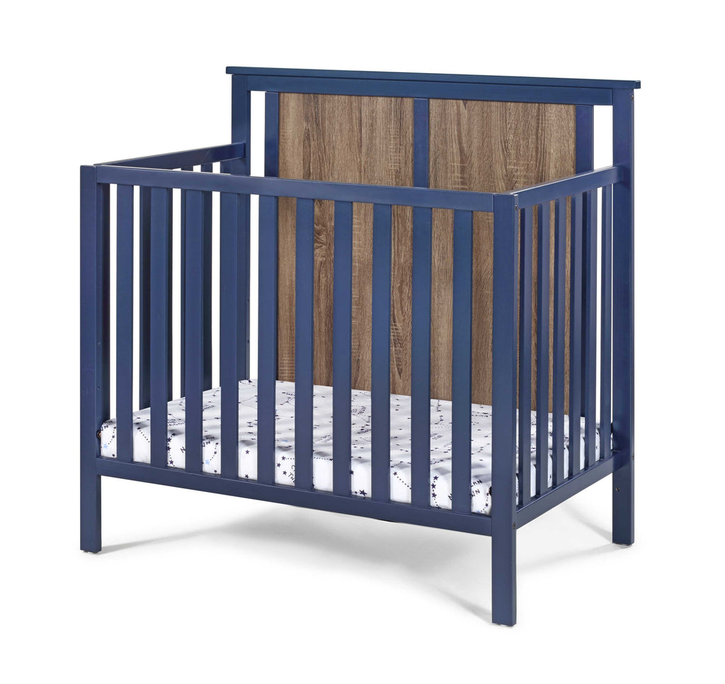 Connelly Mini Crib With Mattress Pad Midnight Blue/Vintage Walnut | Premium Home Decor - Grand Goldman